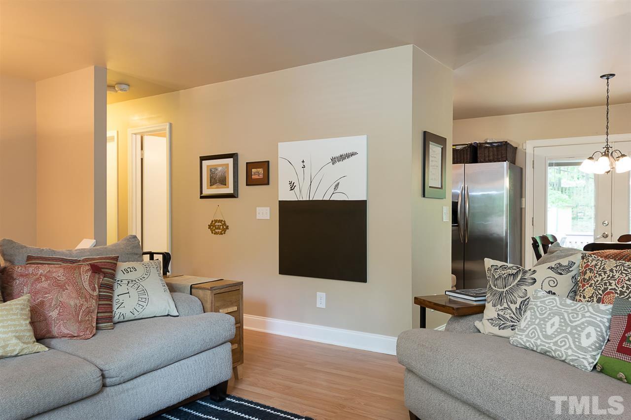 7713 Prospector Place Raleigh, NC 27615 - Photo 4 of 18 a living room with furniture and a flat screen tv