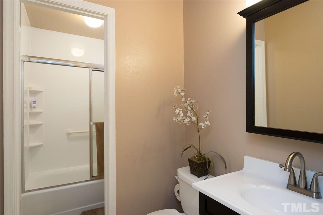 7713 Prospector Place Raleigh, NC 27615 - Photo 10 of 18 a bathroom with a sink and a mirror