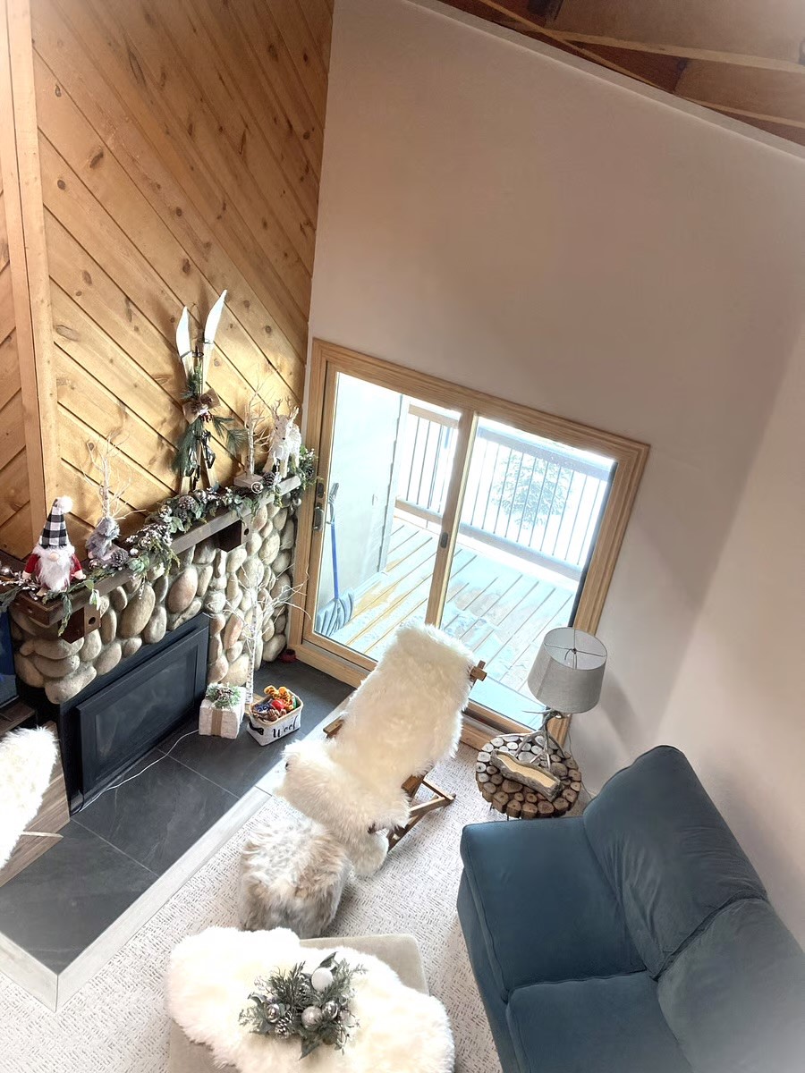 8500 Ryan Gulch Road, Unit 301 Silverthorne, CO 80498 - Photo 12 of 49 a living room with furniture and a large window