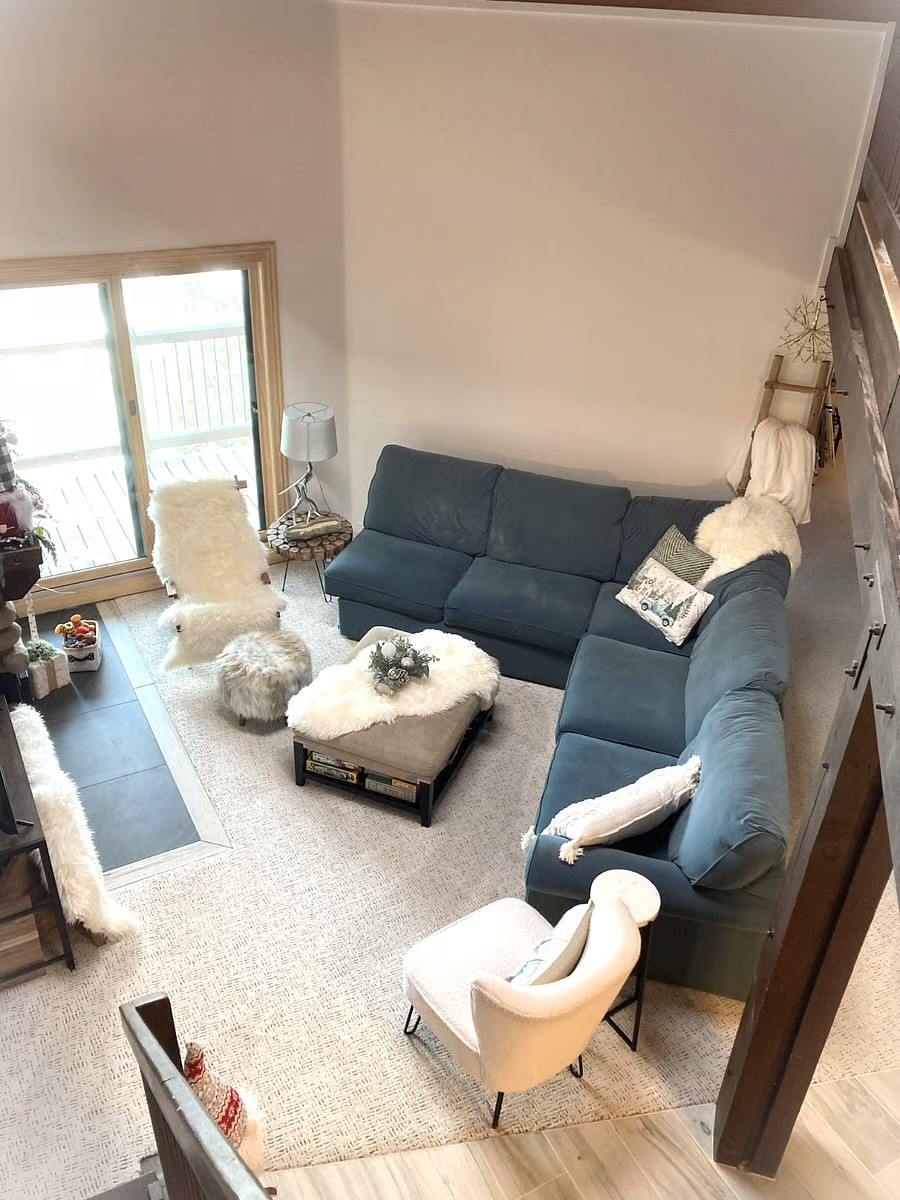 8500 Ryan Gulch Road, Unit 301 Silverthorne, CO 80498 - Photo 13 of 49 a living room with furniture and a large window