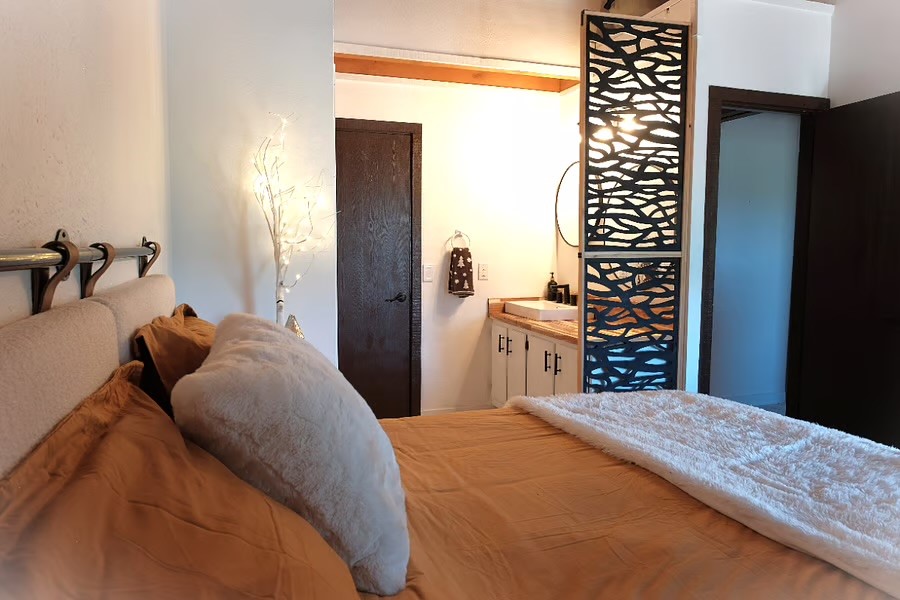 8500 Ryan Gulch Road, Unit 301 Silverthorne, CO 80498 - Photo 20 of 49 a bedroom with a bed and a window