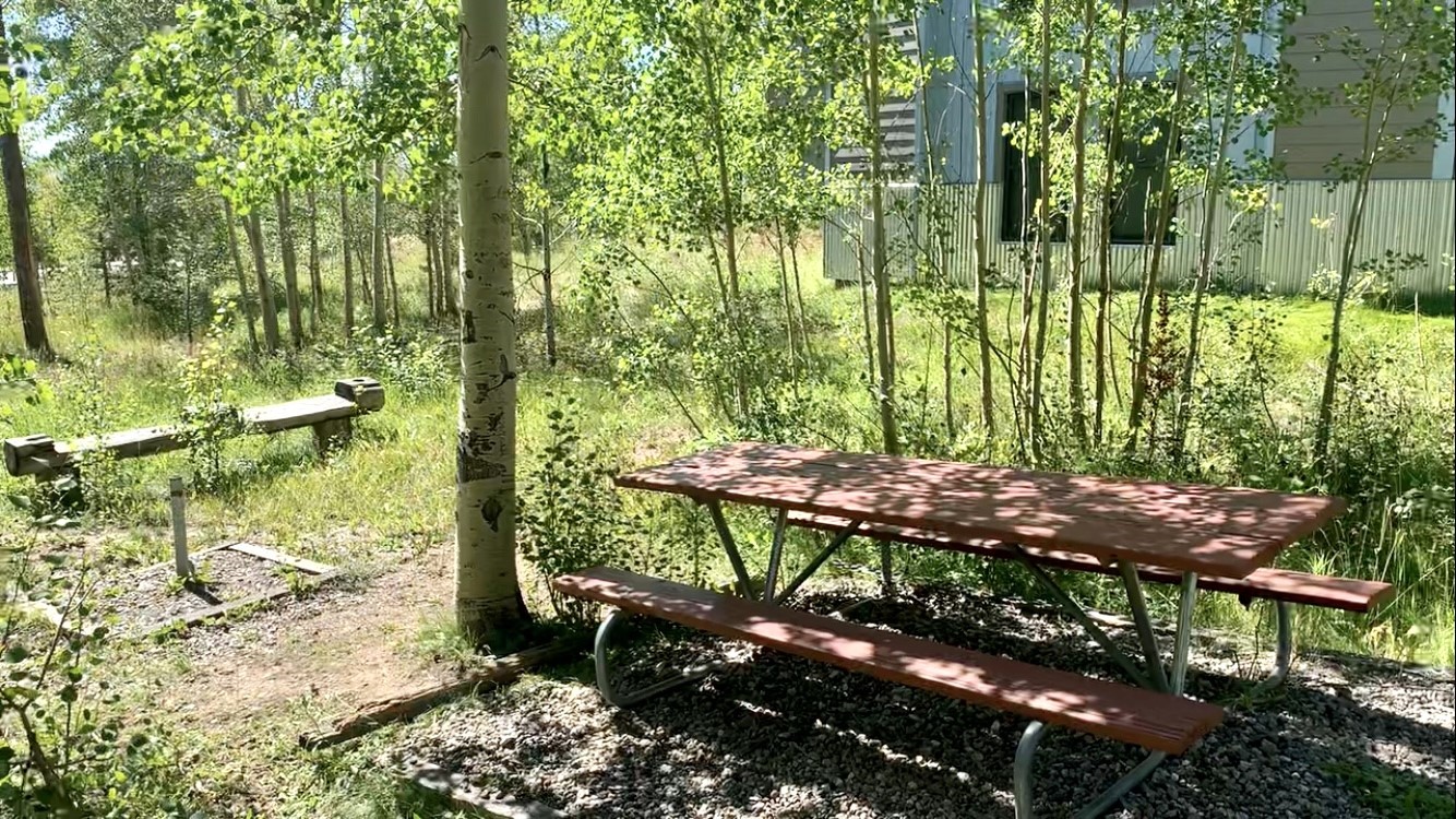 8500 Ryan Gulch Road, Unit 301 Silverthorne, CO 80498 - Photo 35 of 49 a view of yard with green space and seating area