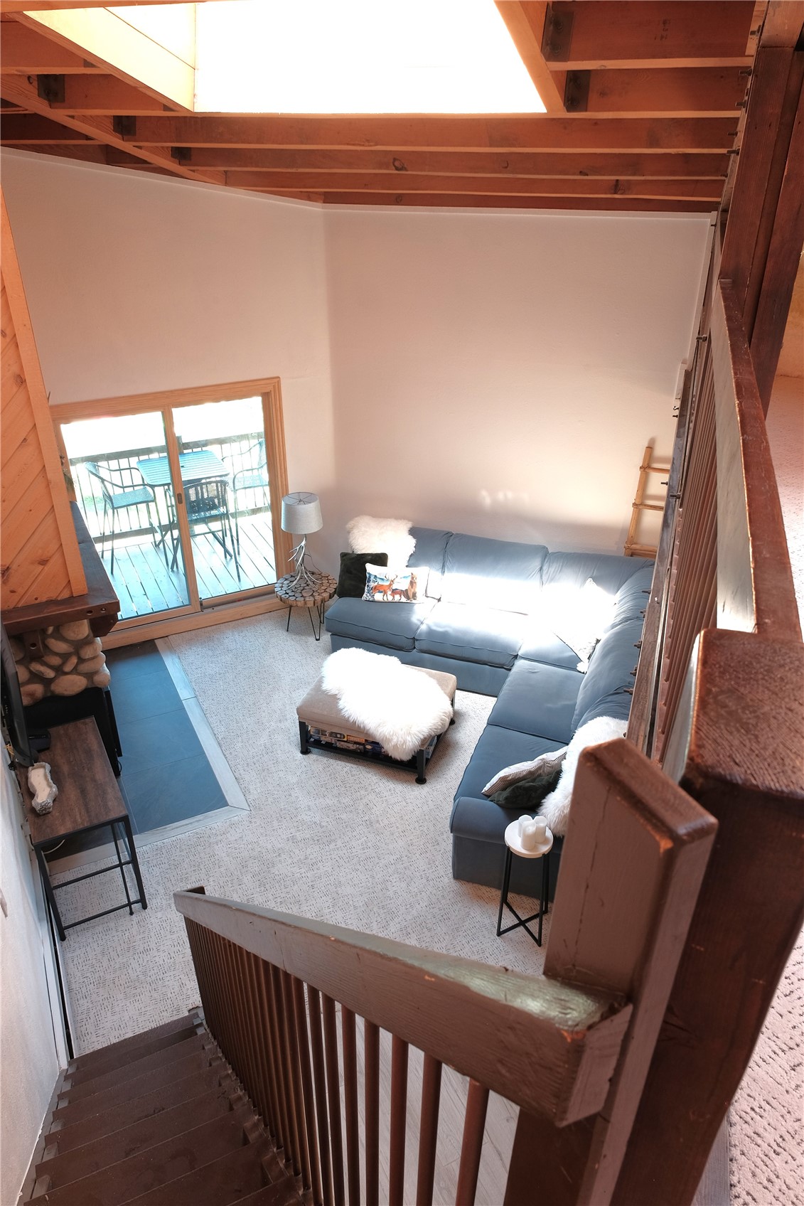 8500 Ryan Gulch Road, Unit 301 Silverthorne, CO 80498 - Photo 6 of 49 a living room with furniture and a flat screen tv