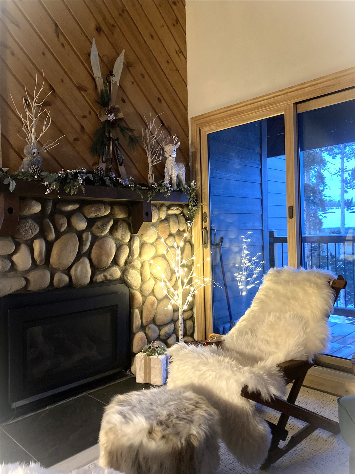 8500 Ryan Gulch Road, Unit 301 Silverthorne, CO 80498 - Photo 8 of 49 a living room with furniture and a fireplace