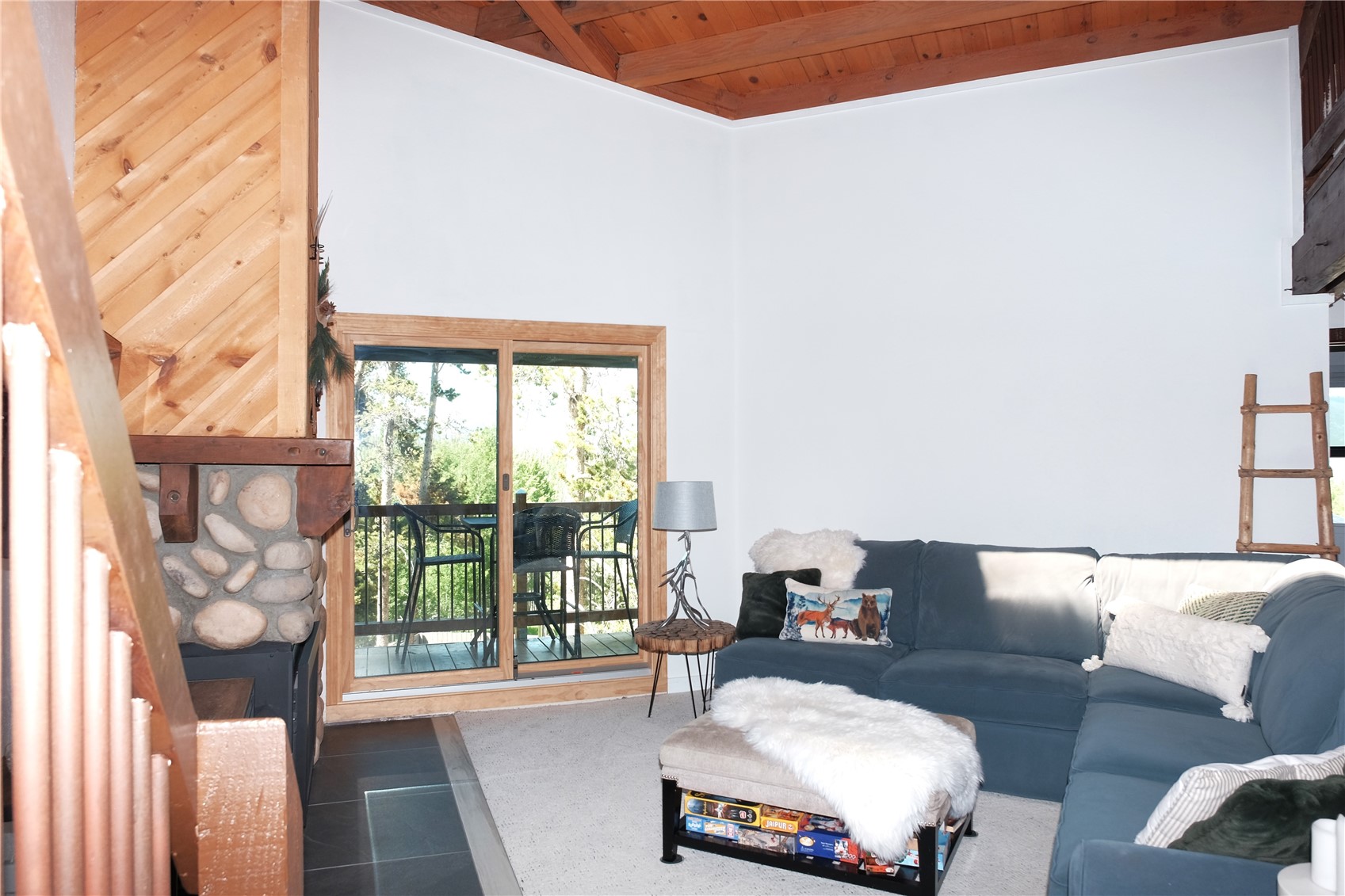 8500 Ryan Gulch Road, Unit 301 Silverthorne, CO 80498 - Photo 9 of 49 a living room with furniture and a large window