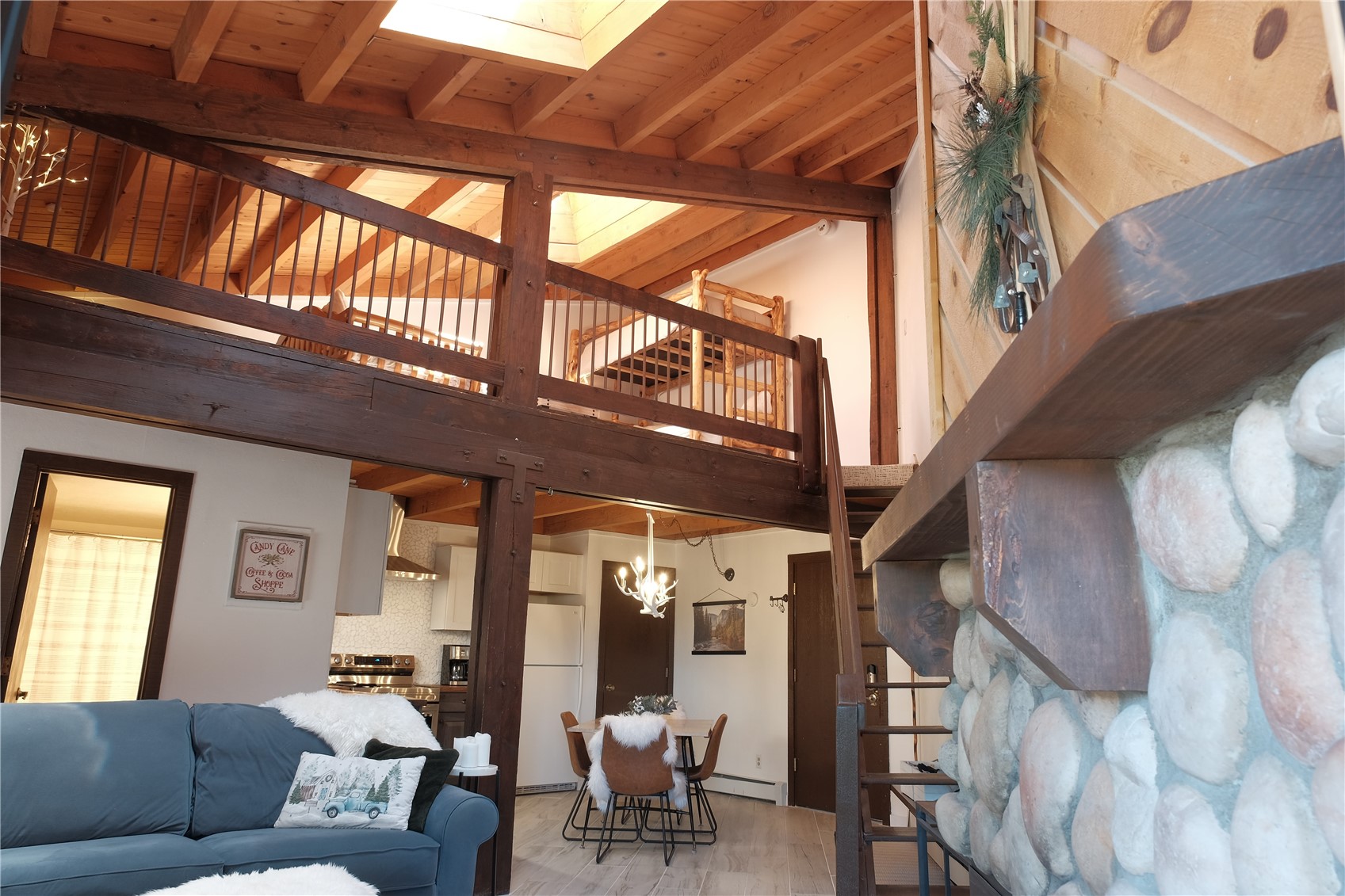 8500 Ryan Gulch Road, Unit 301 Silverthorne, CO 80498 - Photo 10 of 49 a living room with furniture and a window