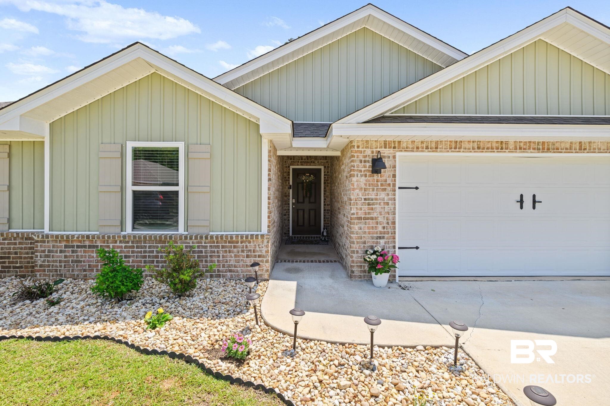8021 Valor Rdg Way North Mobile, AL 36619 - Photo 5 of 34 Brick and siding exterior featuring a covered entry