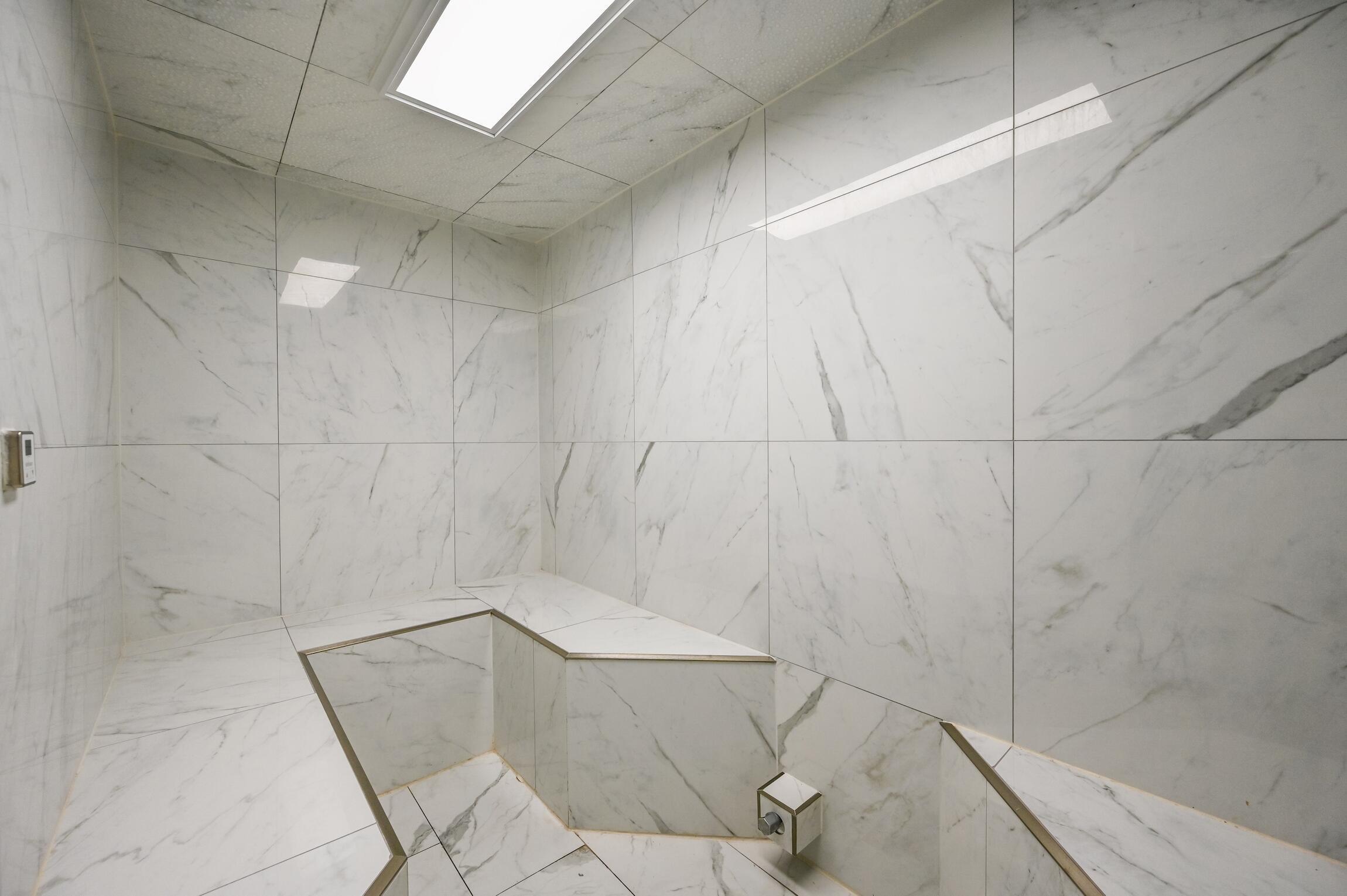 970 Highway 98, Unit 303 Destin, FL 32541 - Photo 22 of 42 a bathroom with a shower