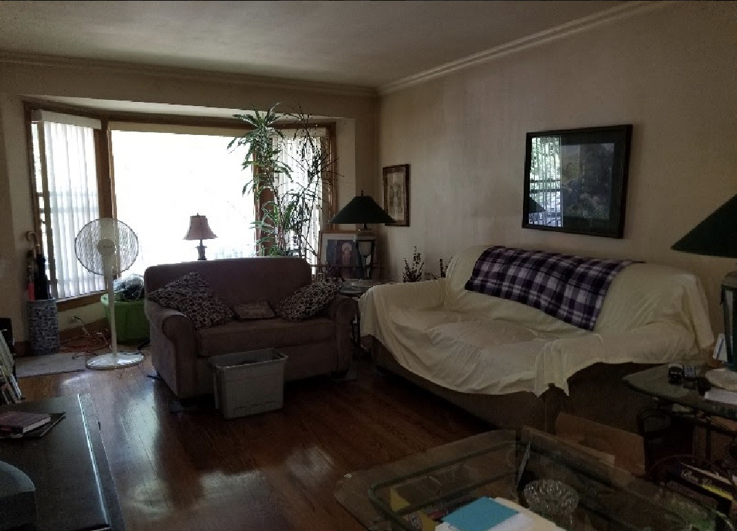 Undisclosed Address Chicago, IL 60625 - Photo 2 of 6 a living room with furniture and a window