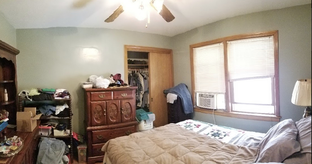 Undisclosed Address Chicago, IL 60625 - Photo 5 of 6 a bedroom with a bed and wooden floor