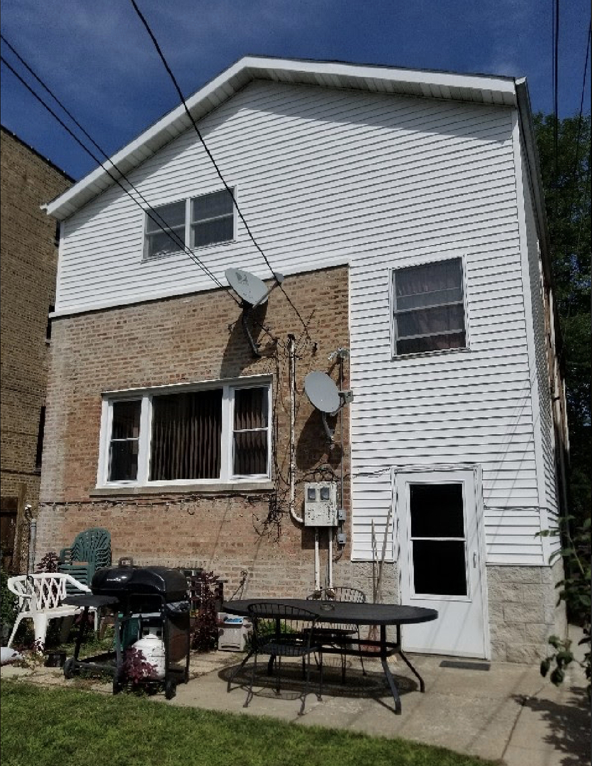 Undisclosed Address Chicago, IL 60625 - Photo 6 of 6 a backyard of a house with seating space