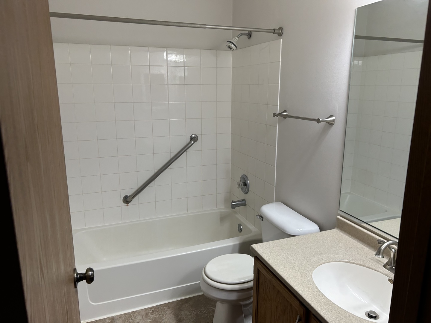 1846 Lucylle Court St. Charles, IL 60174 - Photo 10 of 15 a white toilet sitting next to a bath tub