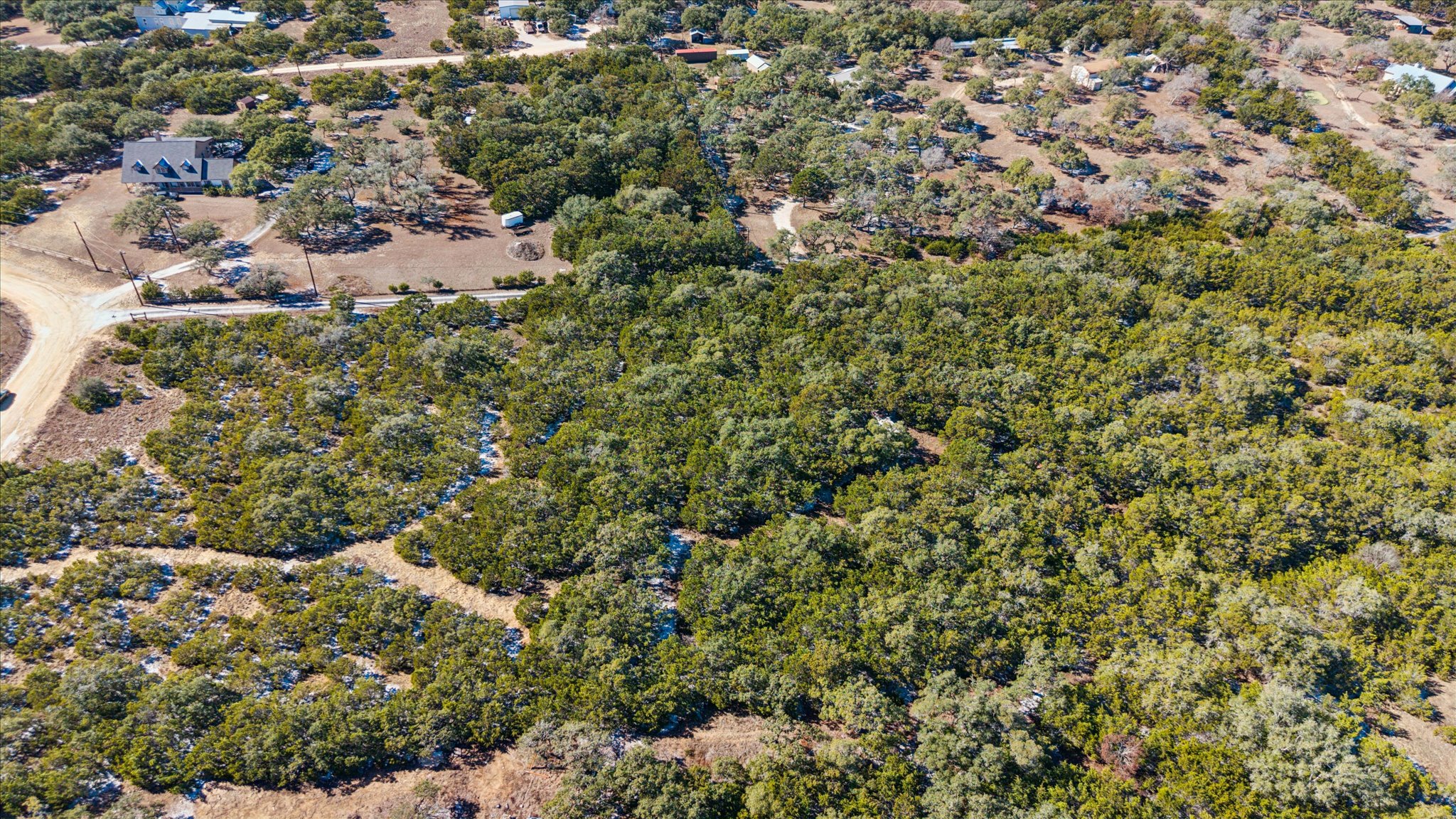 0 Carriage Row Boerne, TX 78006 - Photo 2 of 5 a view of a house with a lush green forest
