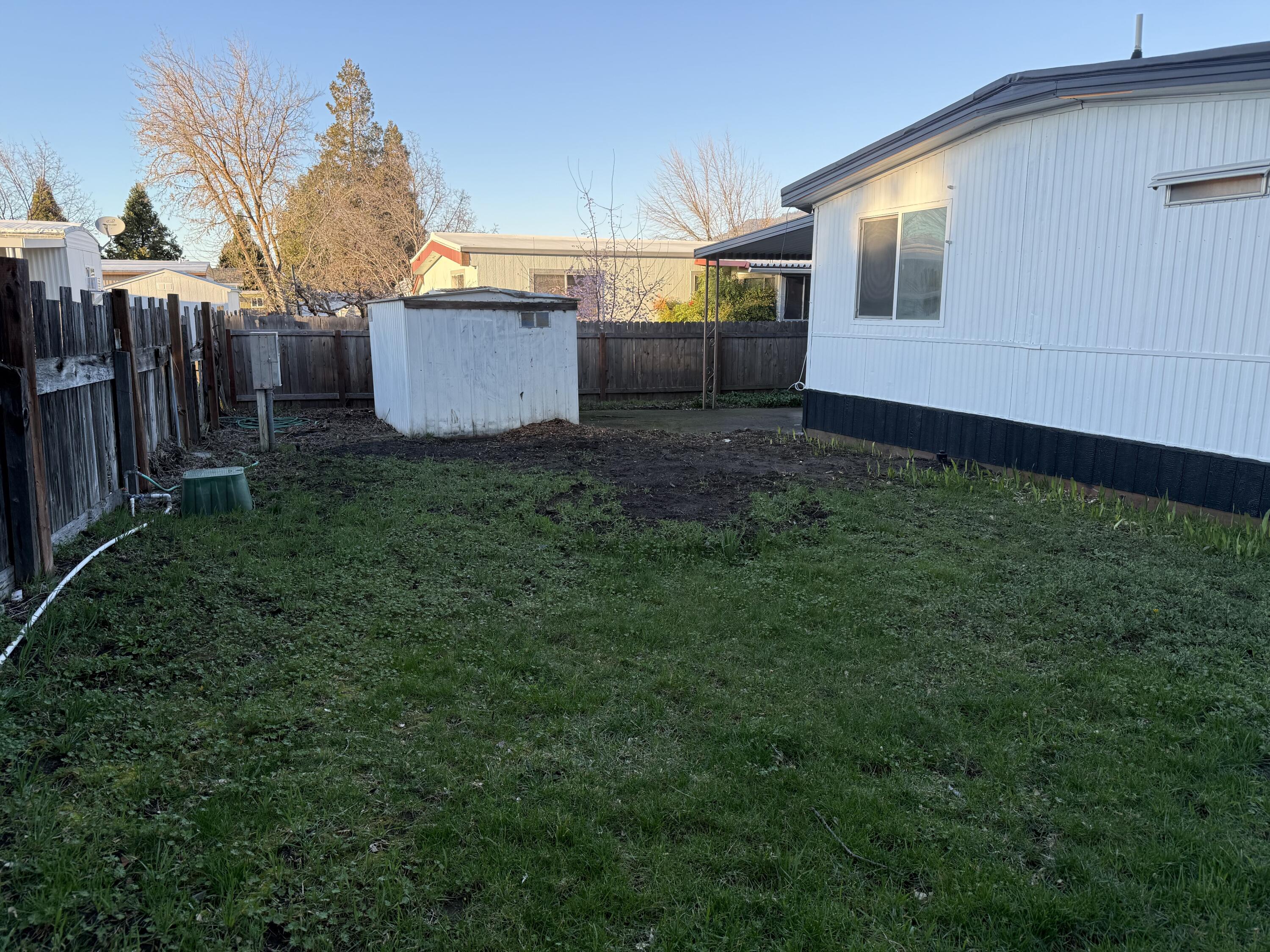 355 Colver Road, Unit 48 Talent, OR 97540 - Photo 11 of 30 a view of a back yard of the house