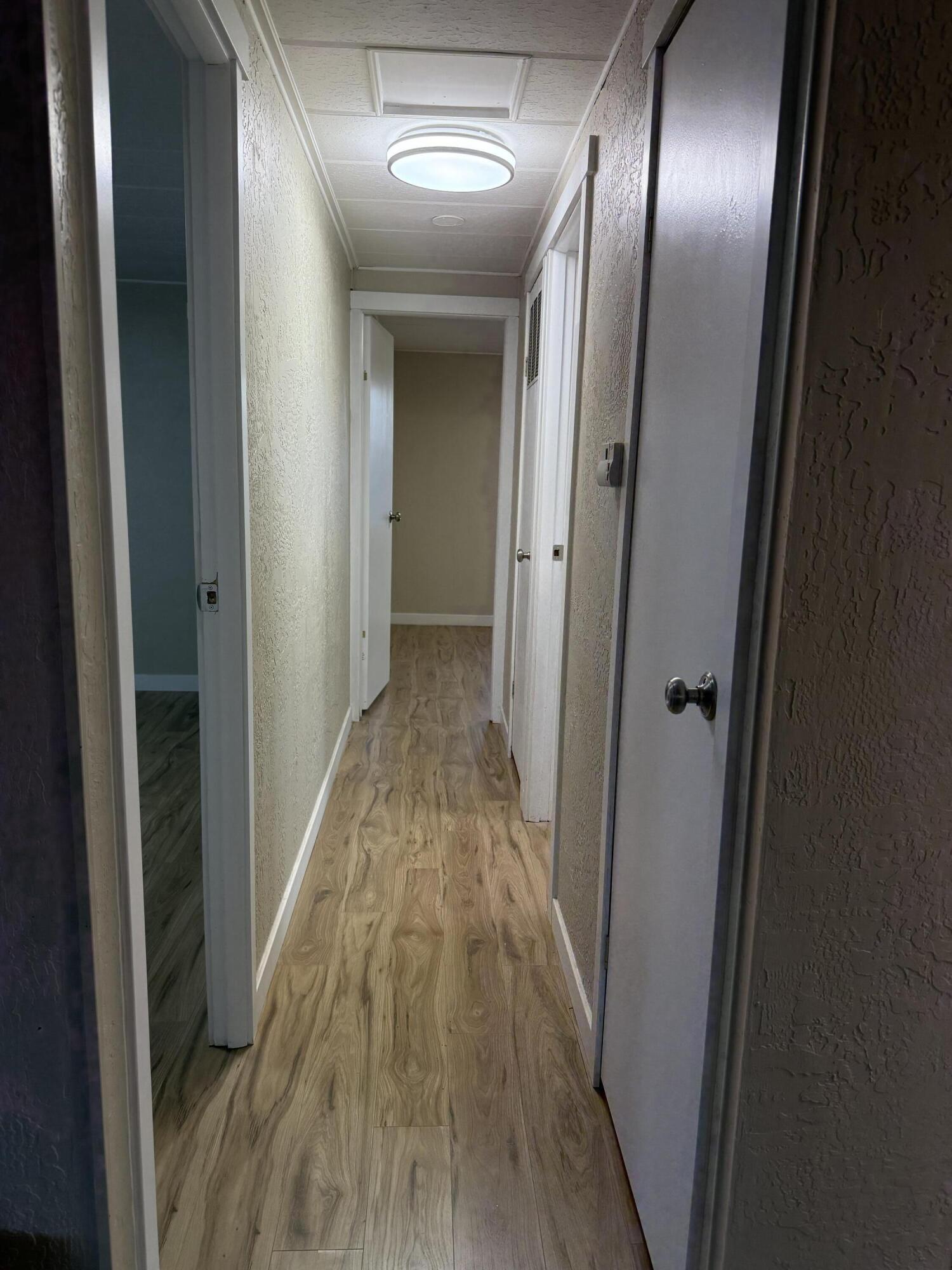 355 Colver Road, Unit 48 Talent, OR 97540 - Photo 27 of 30 a view of hallway with wooden floor