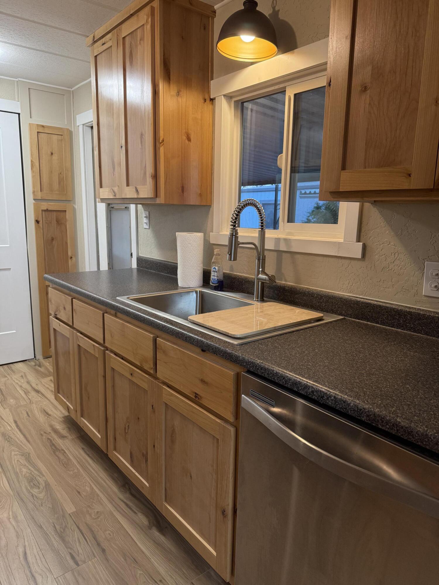 355 Colver Road, Unit 48 Talent, OR 97540 - Photo 4 of 30 a kitchen with stainless steel appliances a sink stove and cabinets