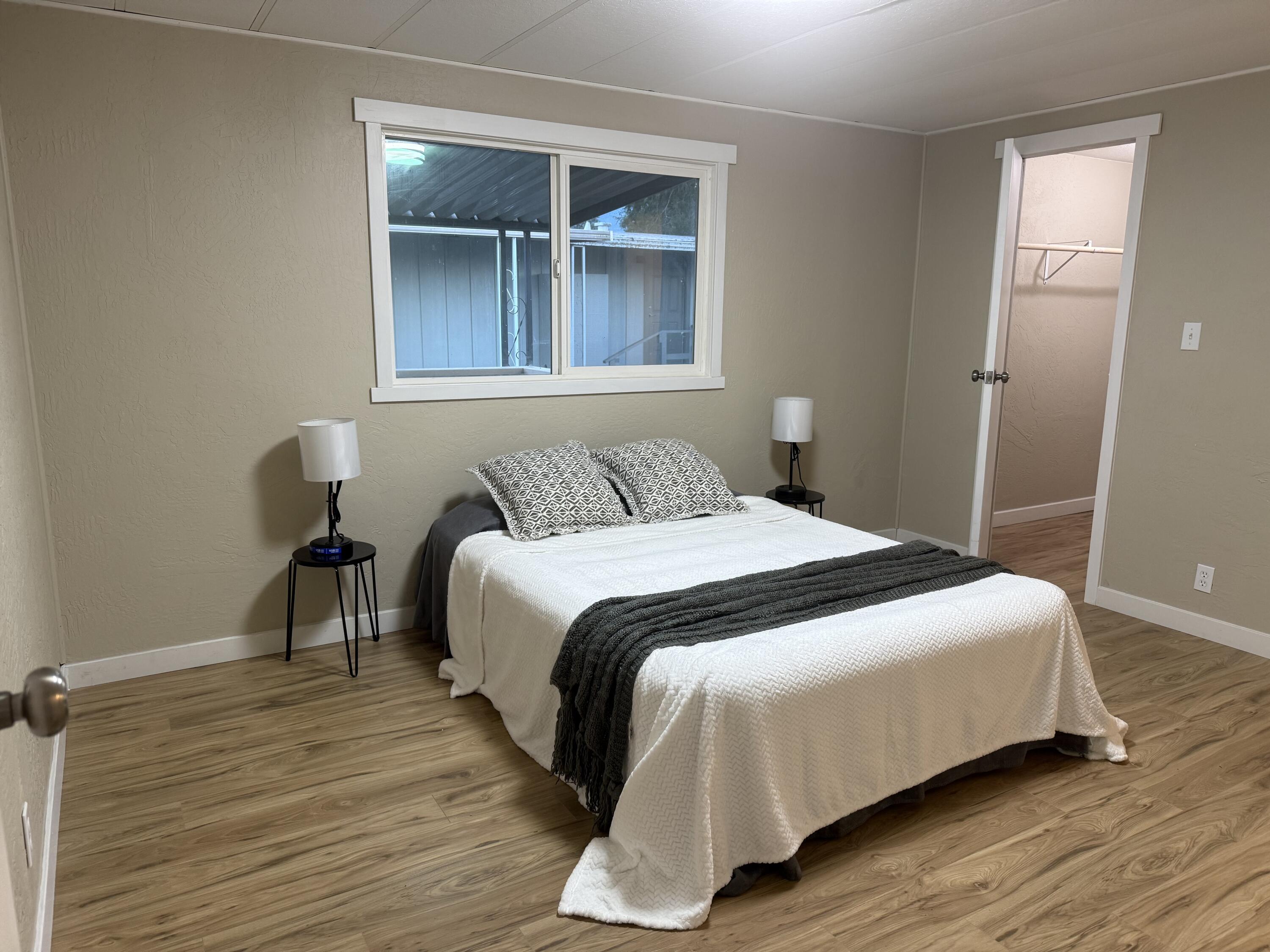 355 Colver Road, Unit 48 Talent, OR 97540 - Photo 5 of 30 a bedroom with a bed and a window