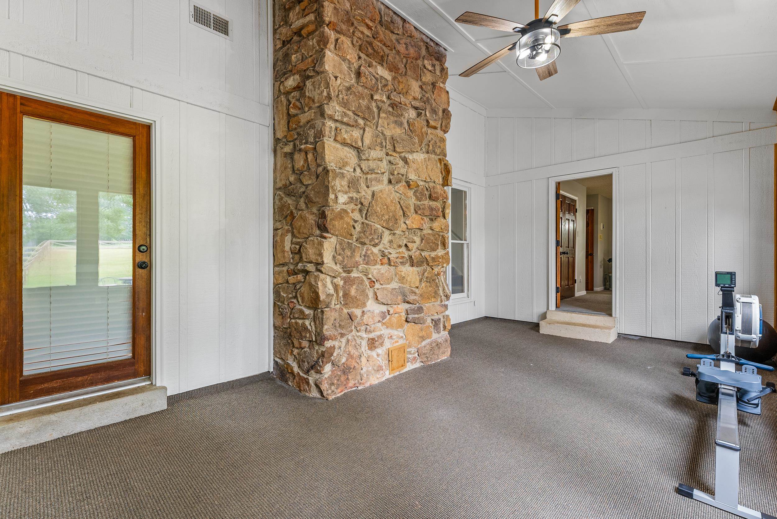 12389 Macon Road Collierville, TN 38017 - Photo 21 of 37 Interior space with ceiling fan, wood walls, lofted ceiling, and carpet flooring