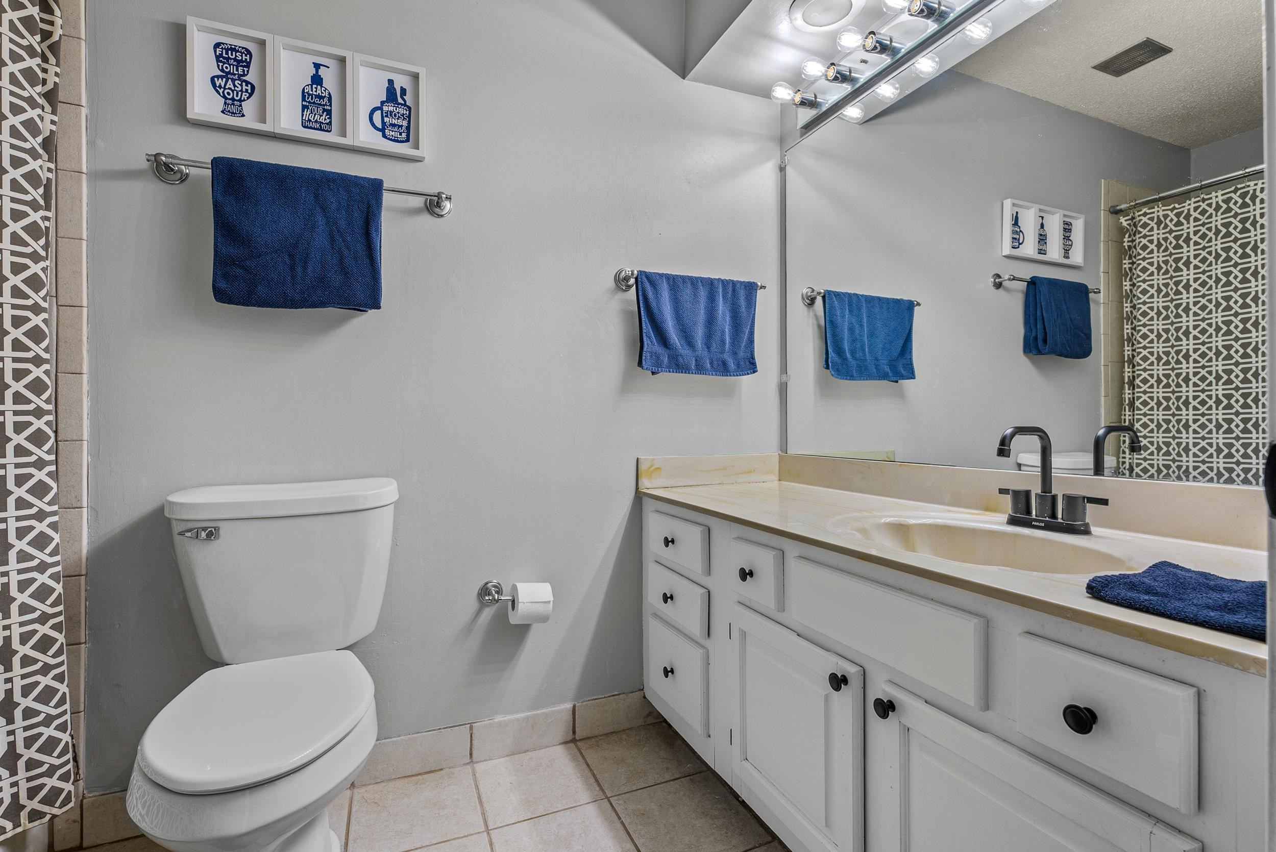 12389 Macon Road Collierville, TN 38017 - Photo 30 of 37 Bathroom with a textured ceiling, toilet, vanity, and tile patterned flooring