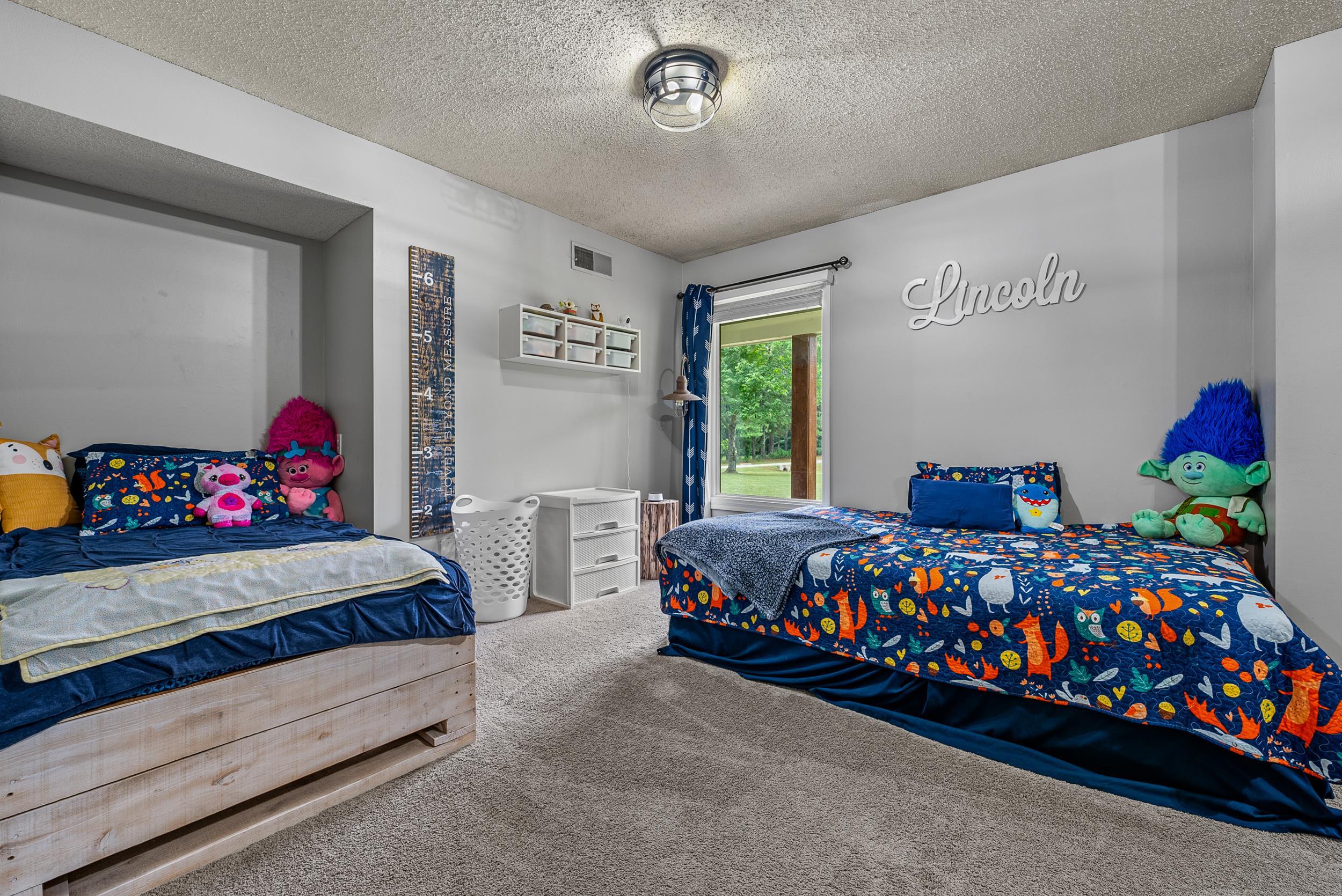 12389 Macon Road Collierville, TN 38017 - Photo 31 of 37 Bedroom with a textured ceiling and carpet