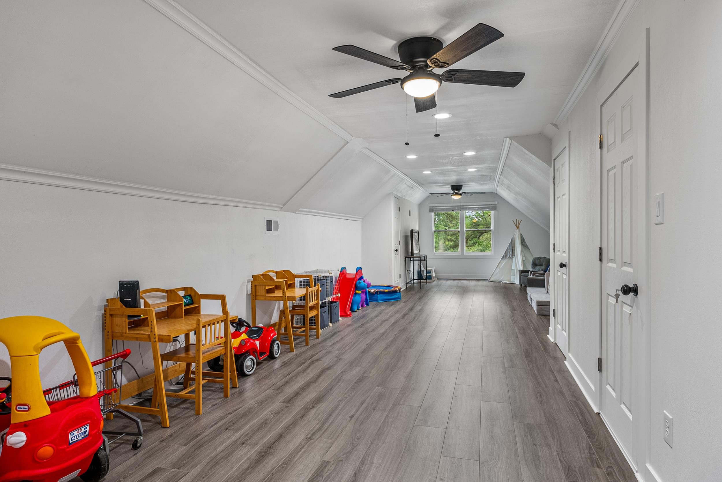 12389 Macon Road Collierville, TN 38017 - Photo 33 of 37 Playroom featuring ceiling fan, vaulted ceiling, ornamental molding, and hardwood / wood-style flooring