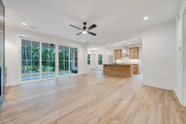 a bathroom with a granite countertop double vanity sink and mirror