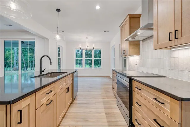 a view of empty room with wooden floor and window