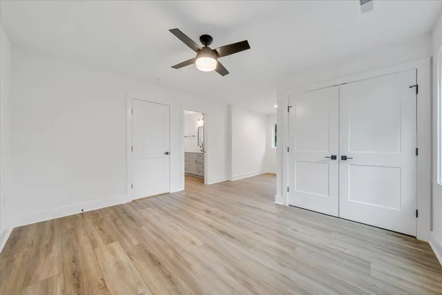 an aerial view of a house with a garden and trees