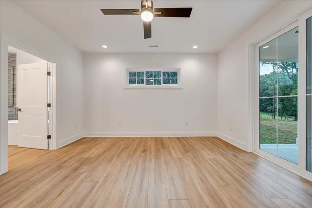 a view of a patio with table and chairs potted plants