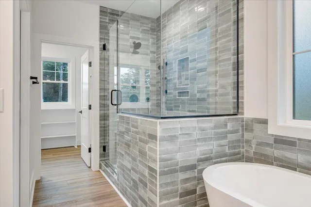 a view of a patio with table and chairs under an umbrella