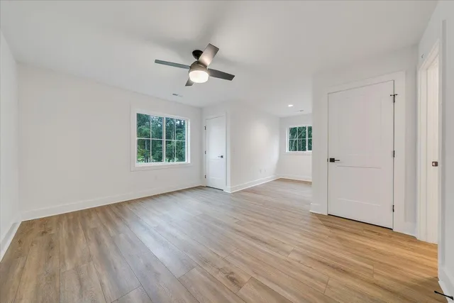 a view of a lake with houses in the back