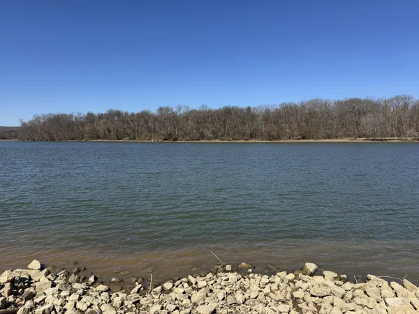 a front view of house with yard and car parked