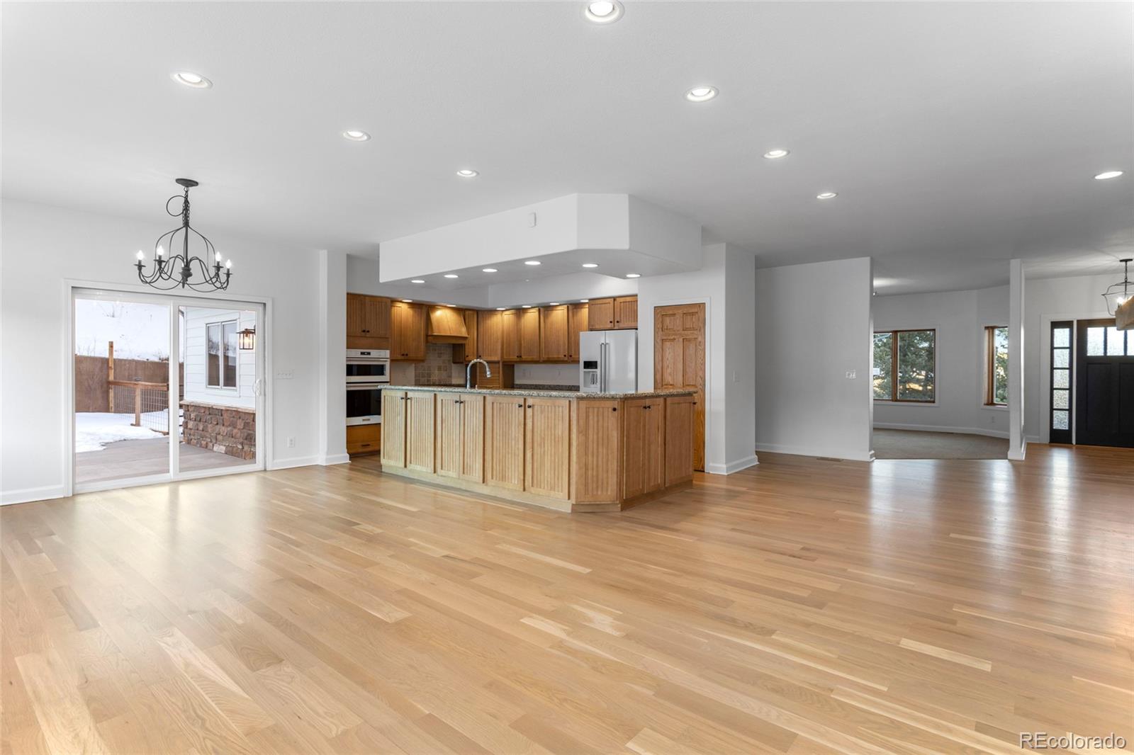 1305 South Grapevine Road Golden, CO 80401 - Photo 16 of 39 a view of a kitchen with a sink and a refrigerator