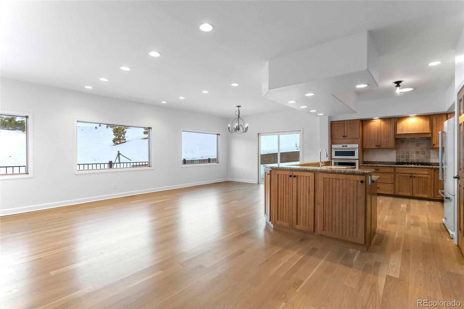 1305 South Grapevine Road Golden, CO 80401 - Photo 17 of 39 a view of kitchen with cabinets and wooden floor