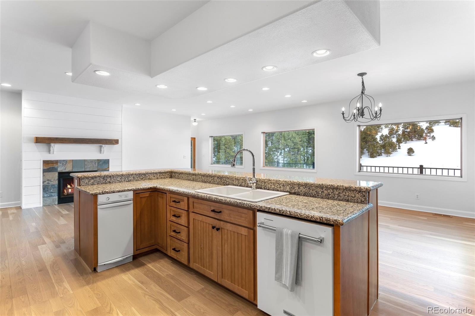 1305 South Grapevine Road Golden, CO 80401 - Photo 18 of 39 a kitchen with a sink stove and cabinets