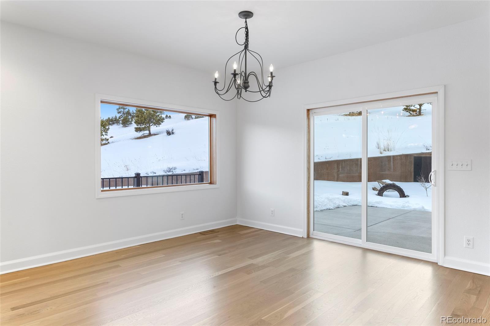 1305 South Grapevine Road Golden, CO 80401 - Photo 23 of 39 a view of a room with wooden floor cabinet and bed