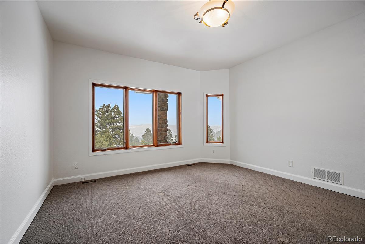 1305 South Grapevine Road Golden, CO 80401 - Photo 24 of 39 an empty room with windows