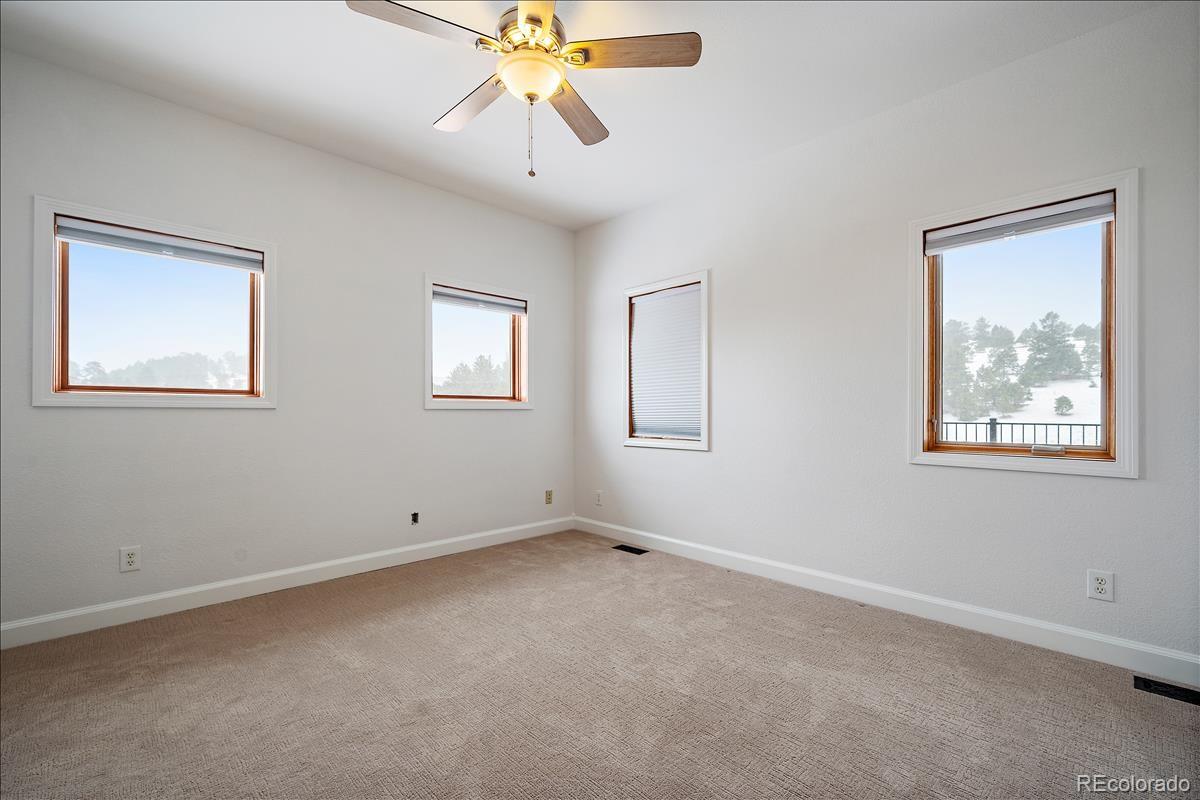 1305 South Grapevine Road Golden, CO 80401 - Photo 30 of 39 a view of an empty room with a window