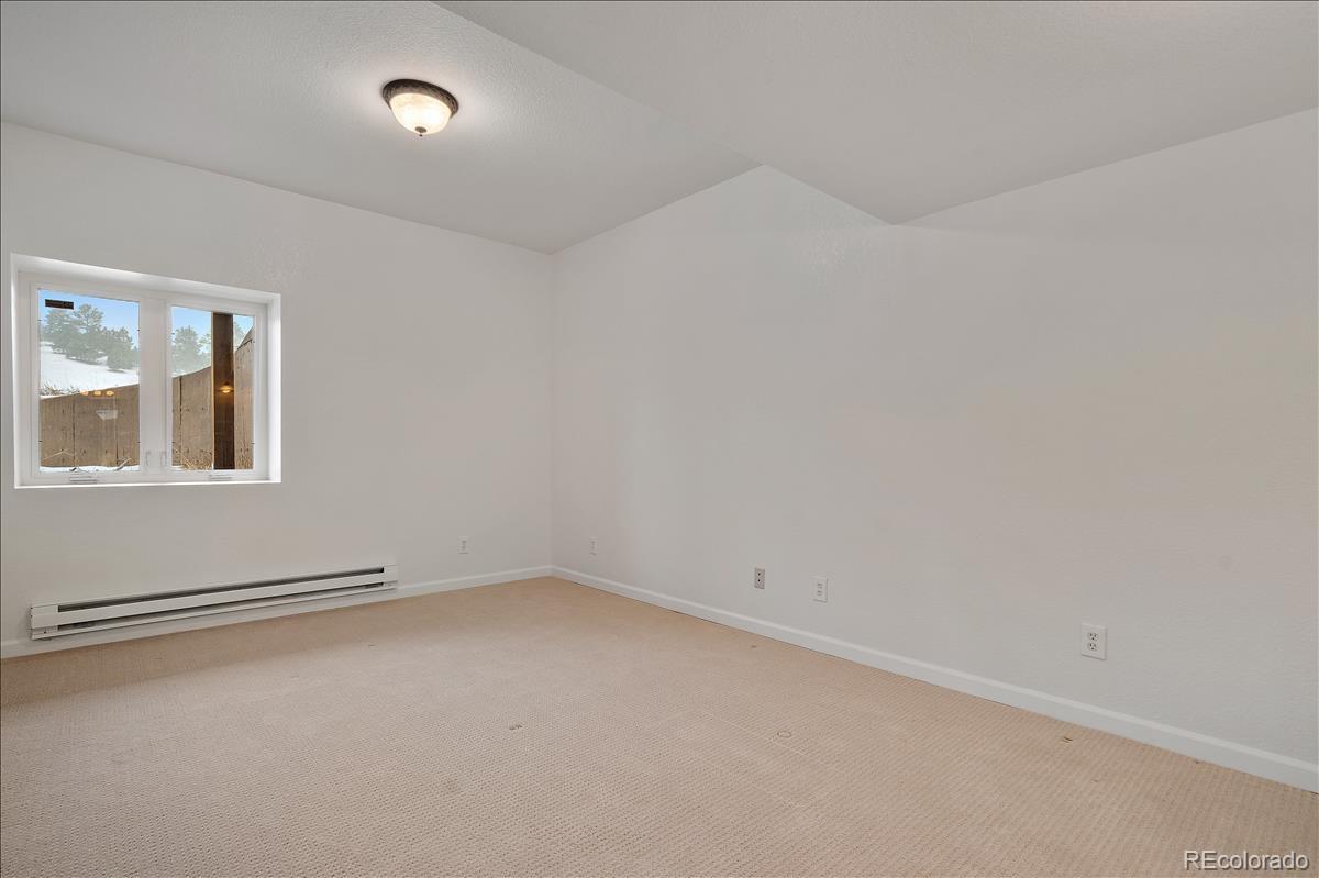 1305 South Grapevine Road Golden, CO 80401 - Photo 31 of 39 an empty room with a window