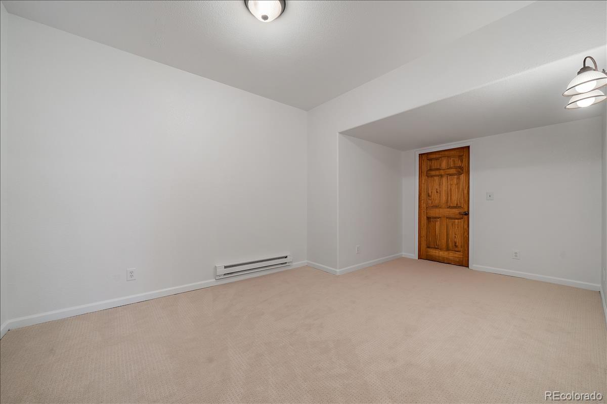 1305 South Grapevine Road Golden, CO 80401 - Photo 34 of 39 an empty room with windows