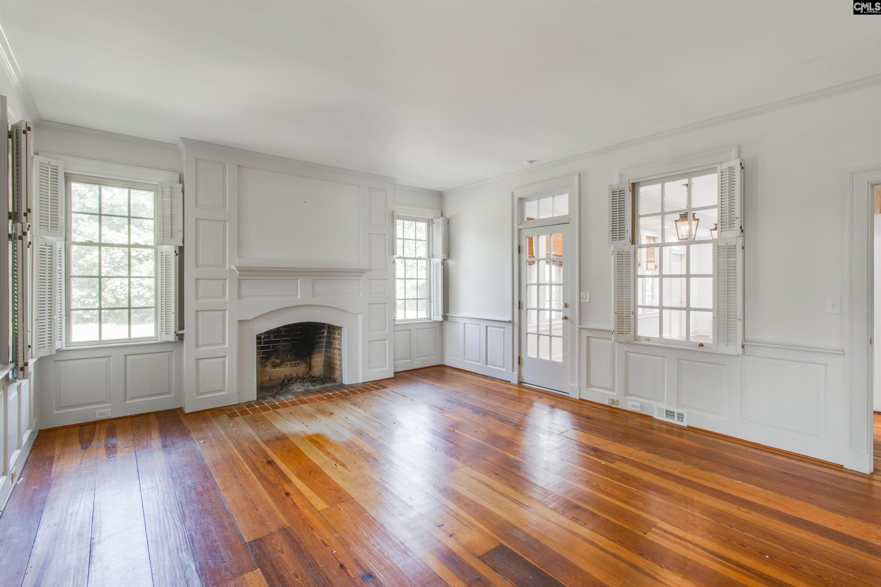 701 Longtown Road Columbia, SC 29229 - Photo 12 of 26 wooden floor fireplace and windows in an empty room