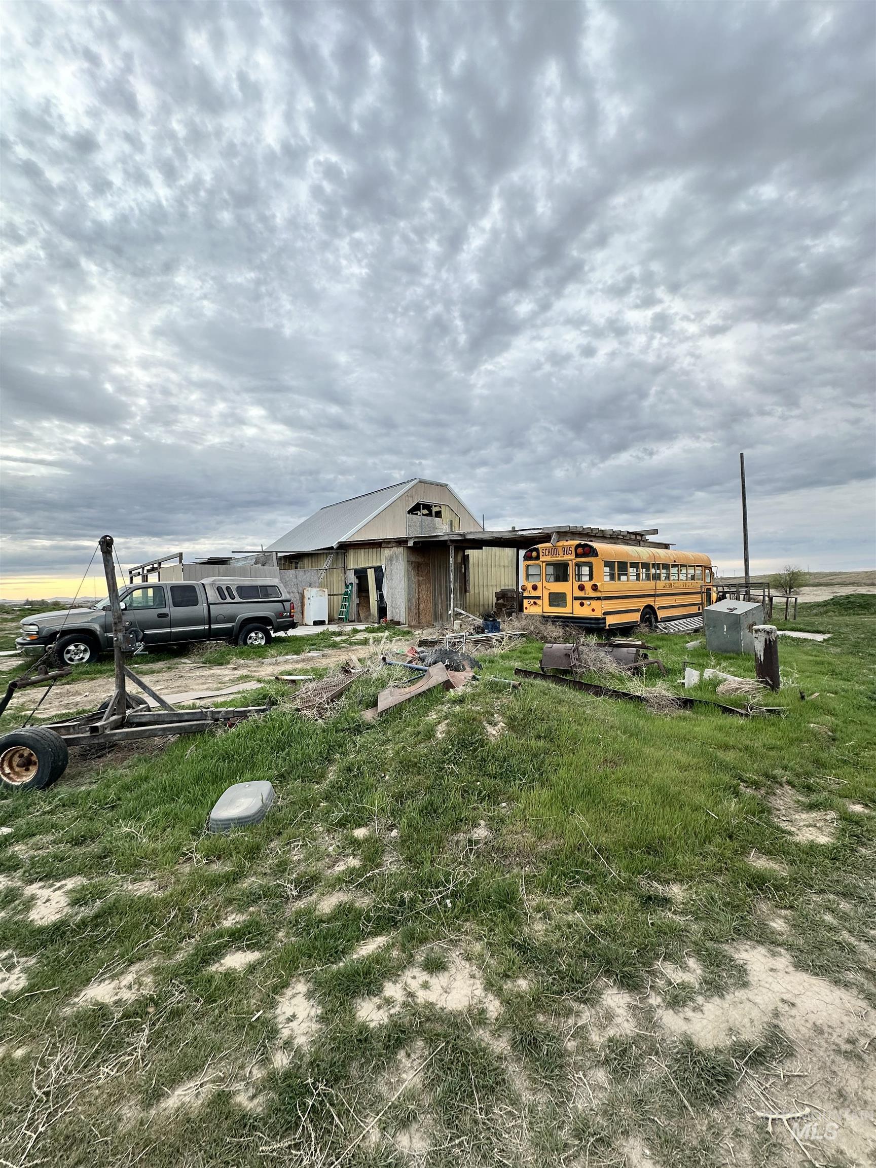 Rear view of property featuring an outdoor structure