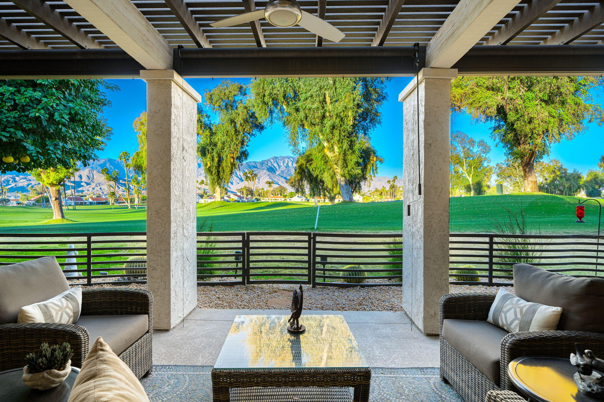 702 Inverness Drive Rancho Mirage, CA 92270 - Photo 1 of 49 a swimming pool with outdoor seating and yard