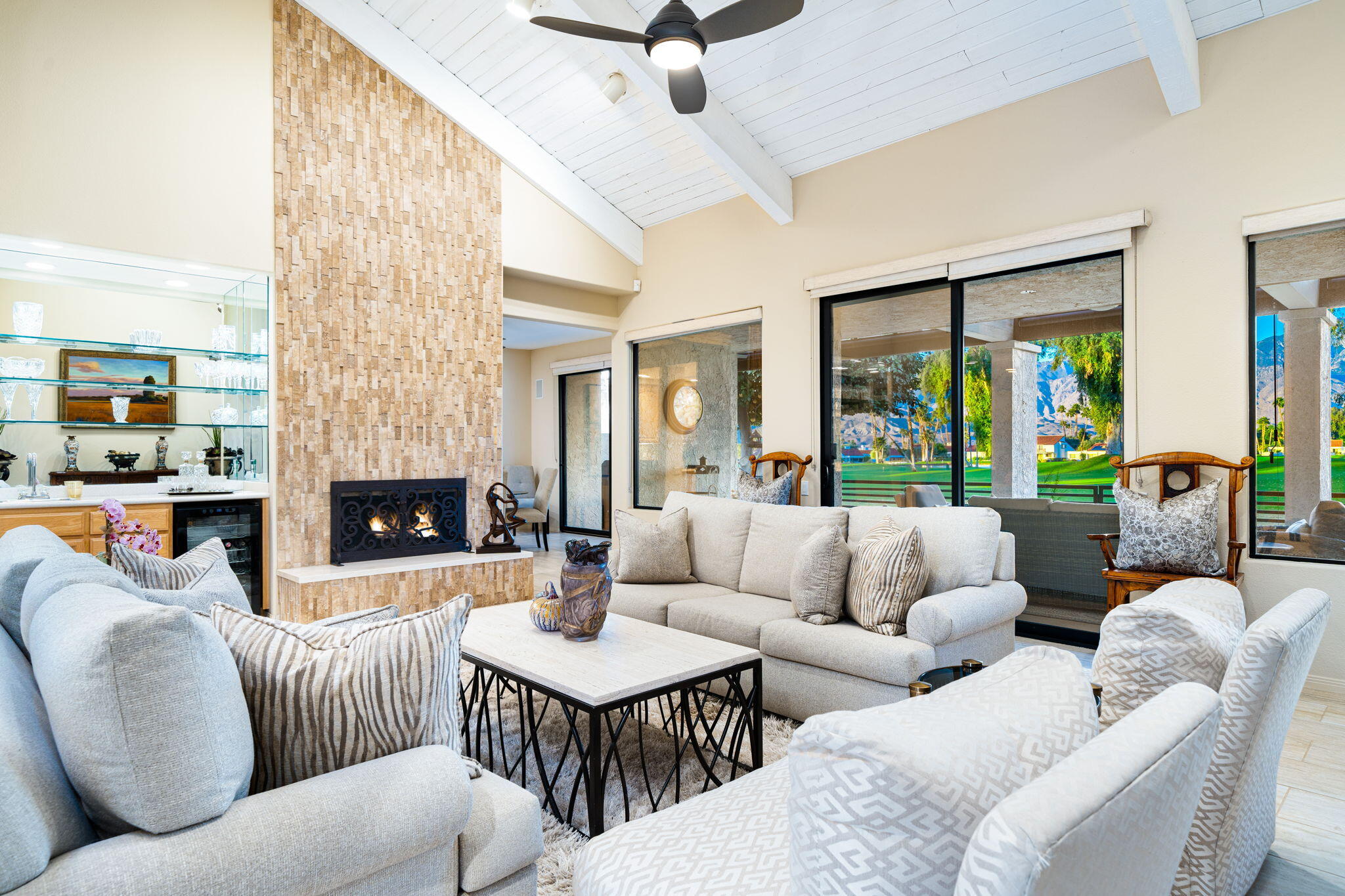 702 Inverness Drive Rancho Mirage, CA 92270 - Photo 13 of 49 a living room with furniture fireplace and a large window