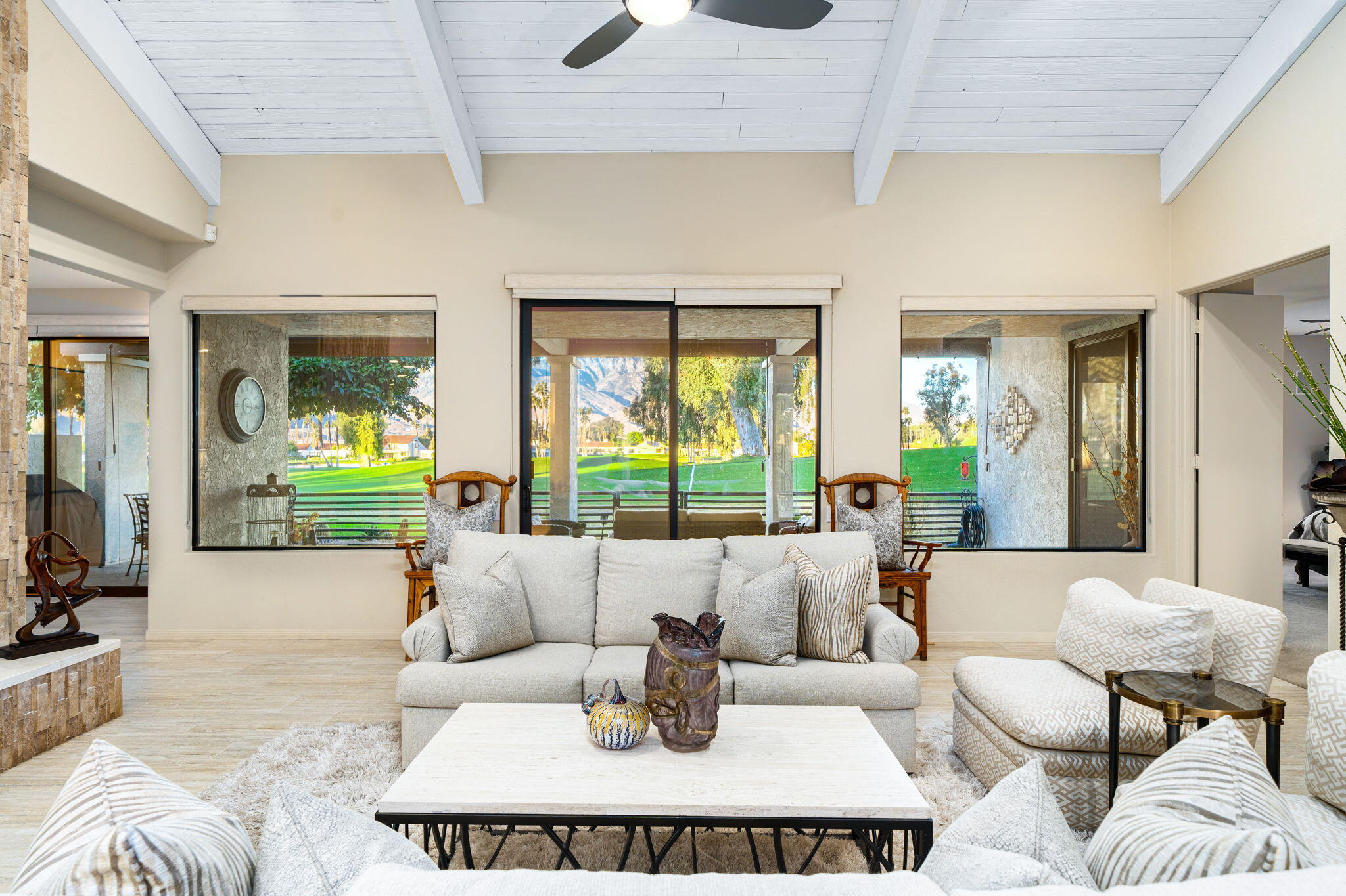 702 Inverness Drive Rancho Mirage, CA 92270 - Photo 14 of 49 a living room with furniture and a large window