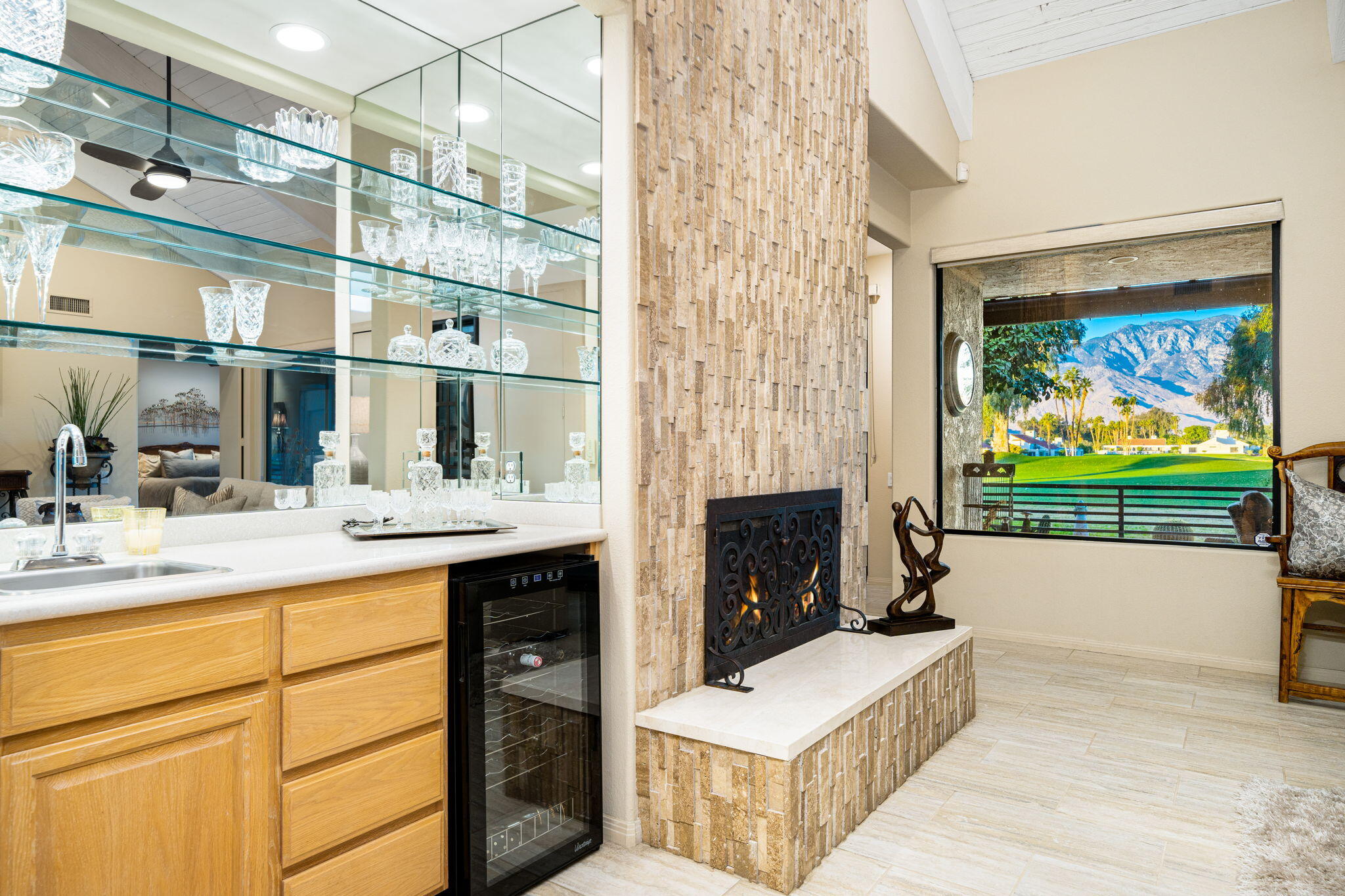 702 Inverness Drive Rancho Mirage, CA 92270 - Photo 18 of 49 a living room with fireplace furniture and a flat screen tv