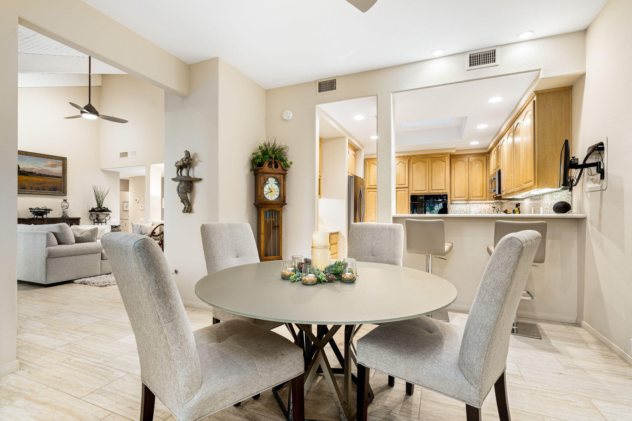 702 Inverness Drive Rancho Mirage, CA 92270 - Photo 20 of 49 a view of a dining room with furniture and wooden floor