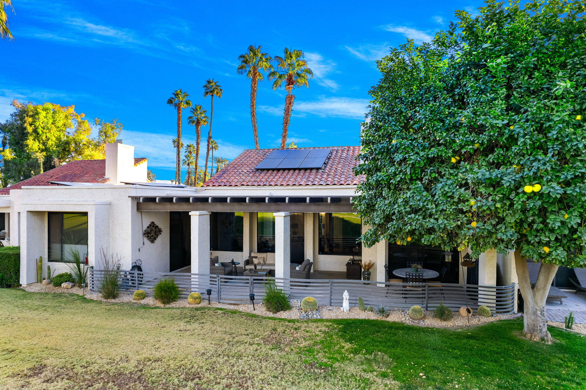 702 Inverness Drive Rancho Mirage, CA 92270 - Photo 2 of 49 a view of a house with patio front of house