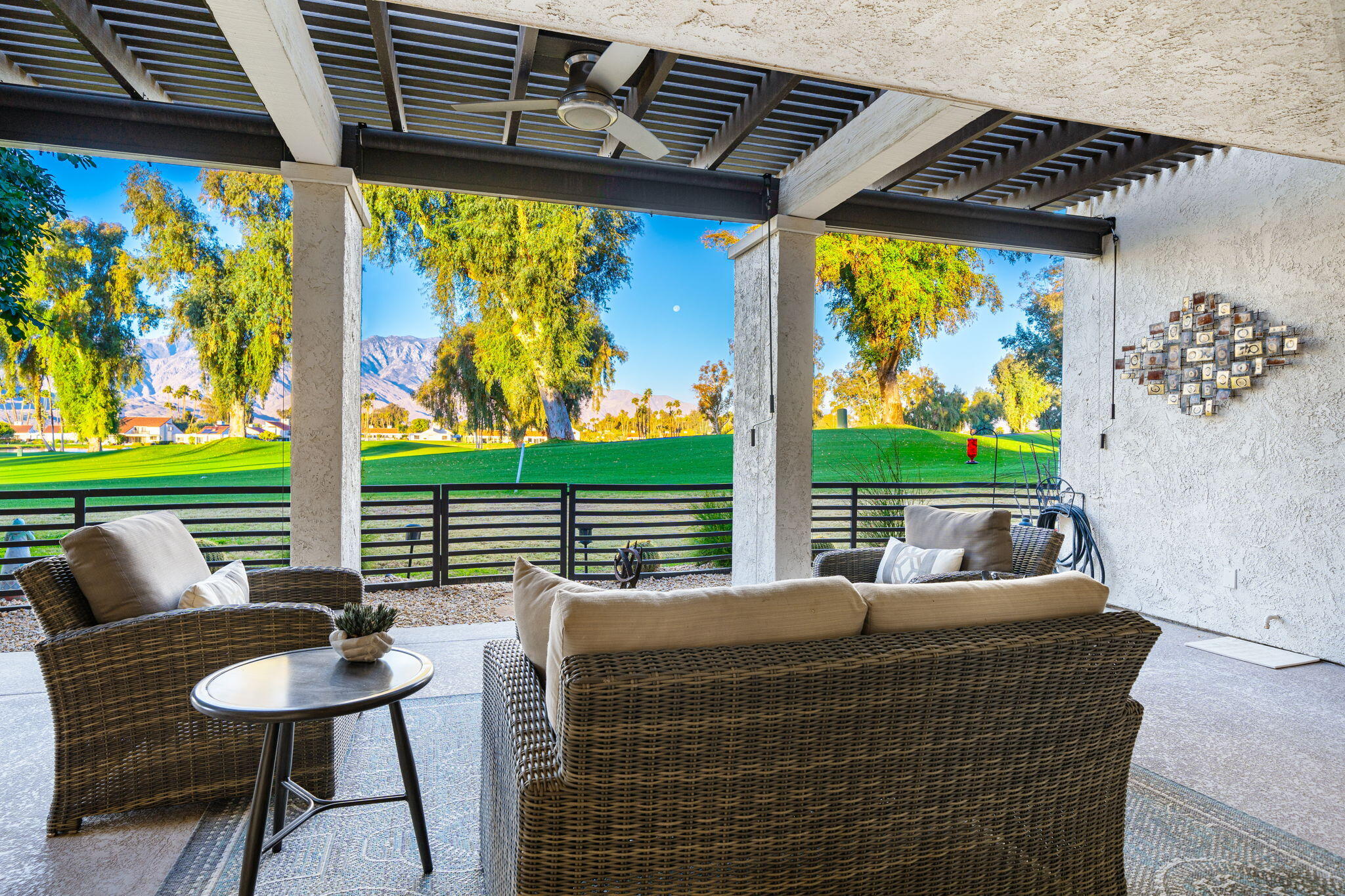 702 Inverness Drive Rancho Mirage, CA 92270 - Photo 25 of 49 a balcony view with a couple of chairs and a large window