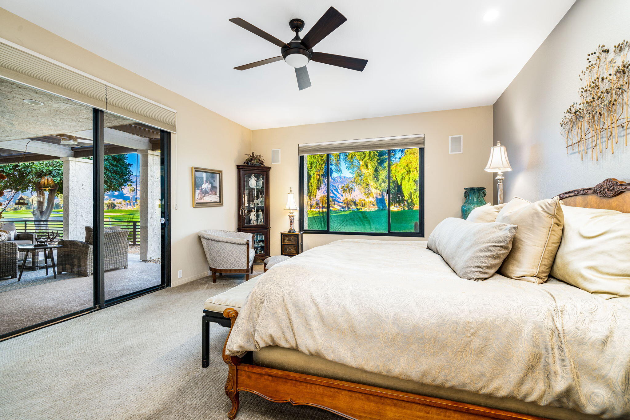 702 Inverness Drive Rancho Mirage, CA 92270 - Photo 32 of 49 a bedroom with a bed and large windows